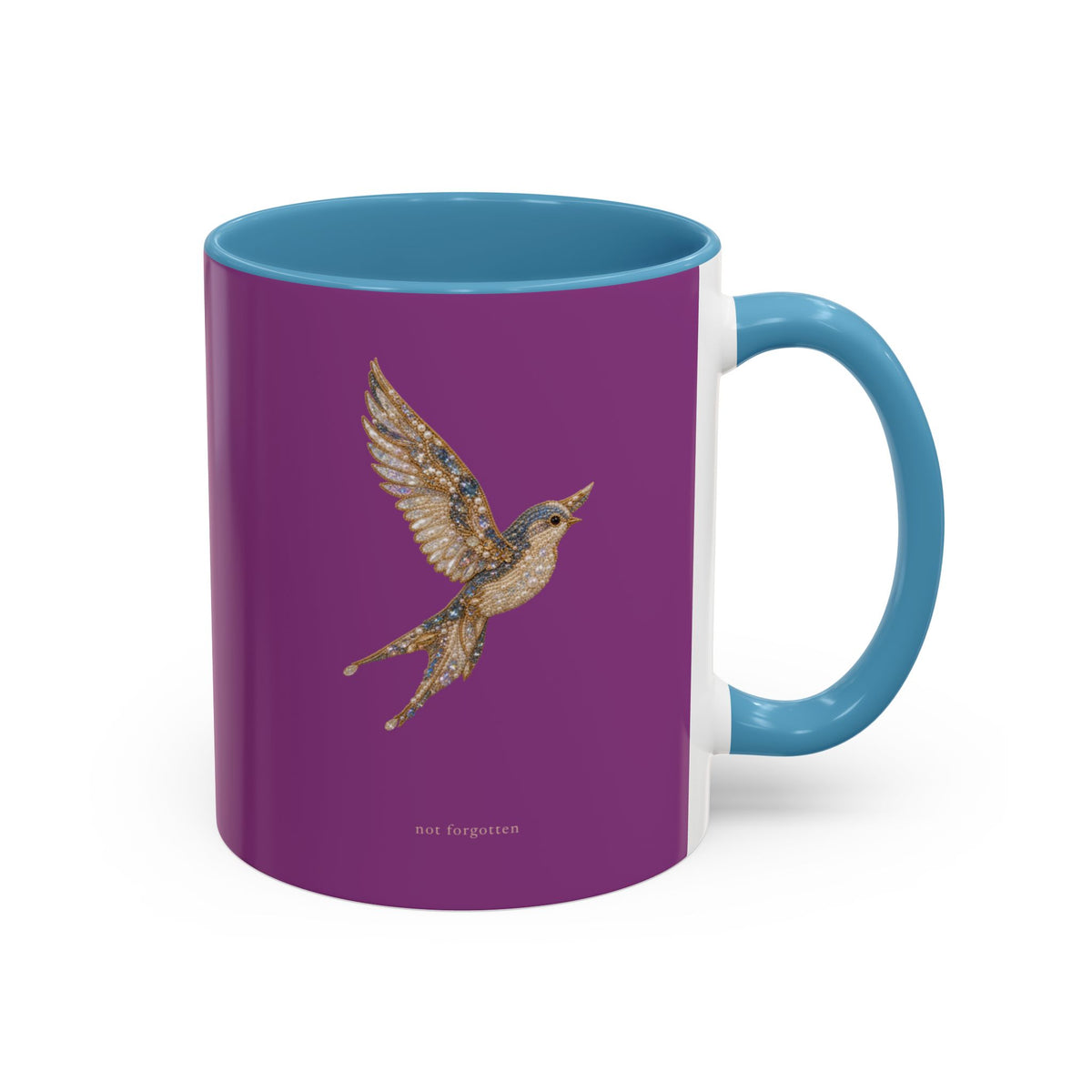 A ceramic mug with a deep purple exterior, a light blue handle and interior, and a detailed illustration of a flying bird on the front. The text 'Ants forgotten' is printed near the bottom.